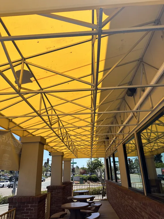 Yellow patio cover and its supporting frame
