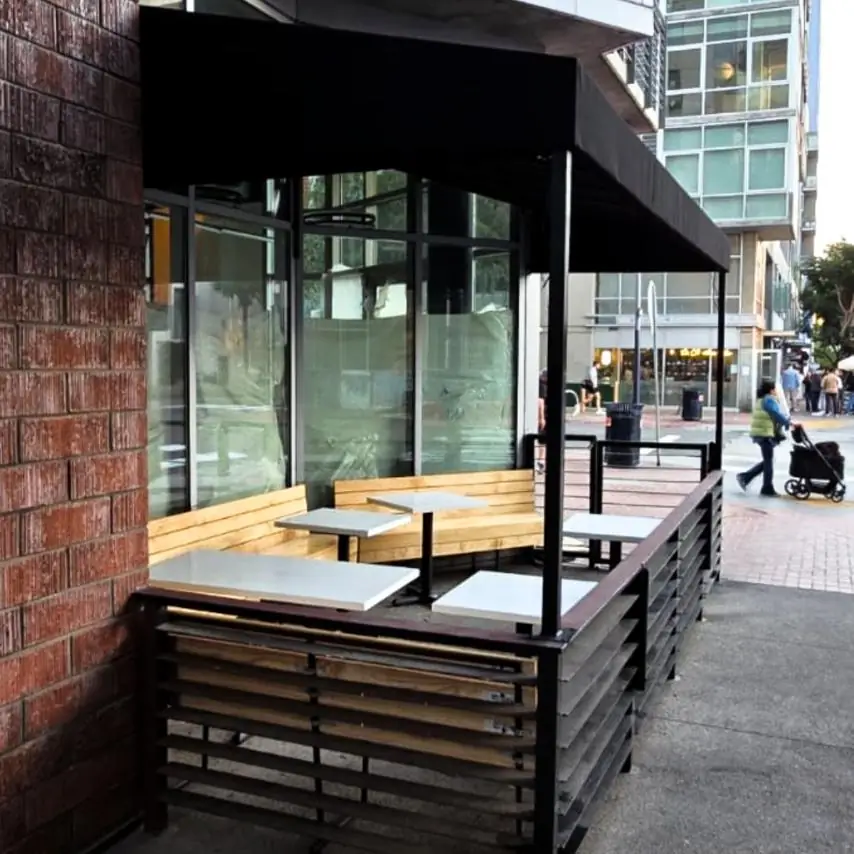 Black patio enclosure with slatted screening and bench seating