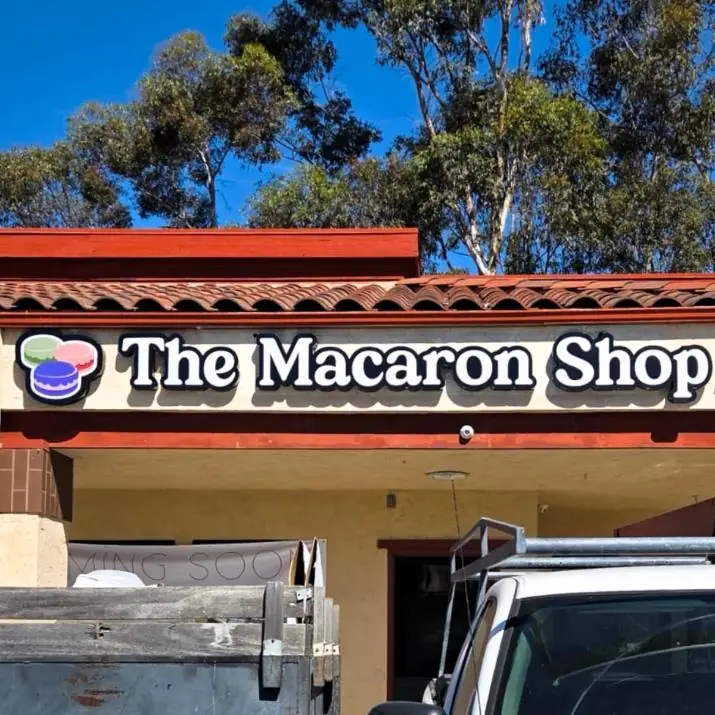 The Macaron Shop channel letters on a tile roof storefront