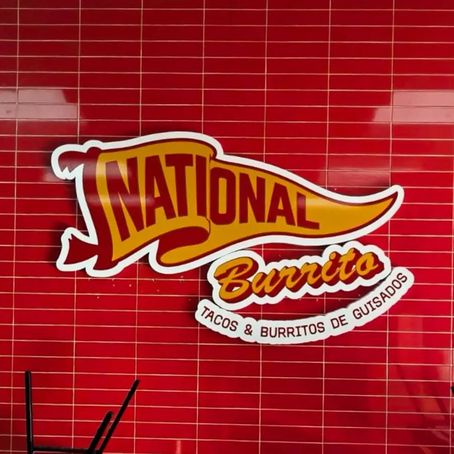 National Burrito logo sign mounted on a red tile wall