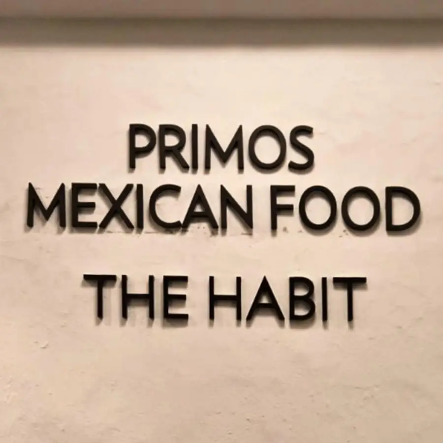 Primos Mexican Food and The Habit flat cut letters on a stucco wall