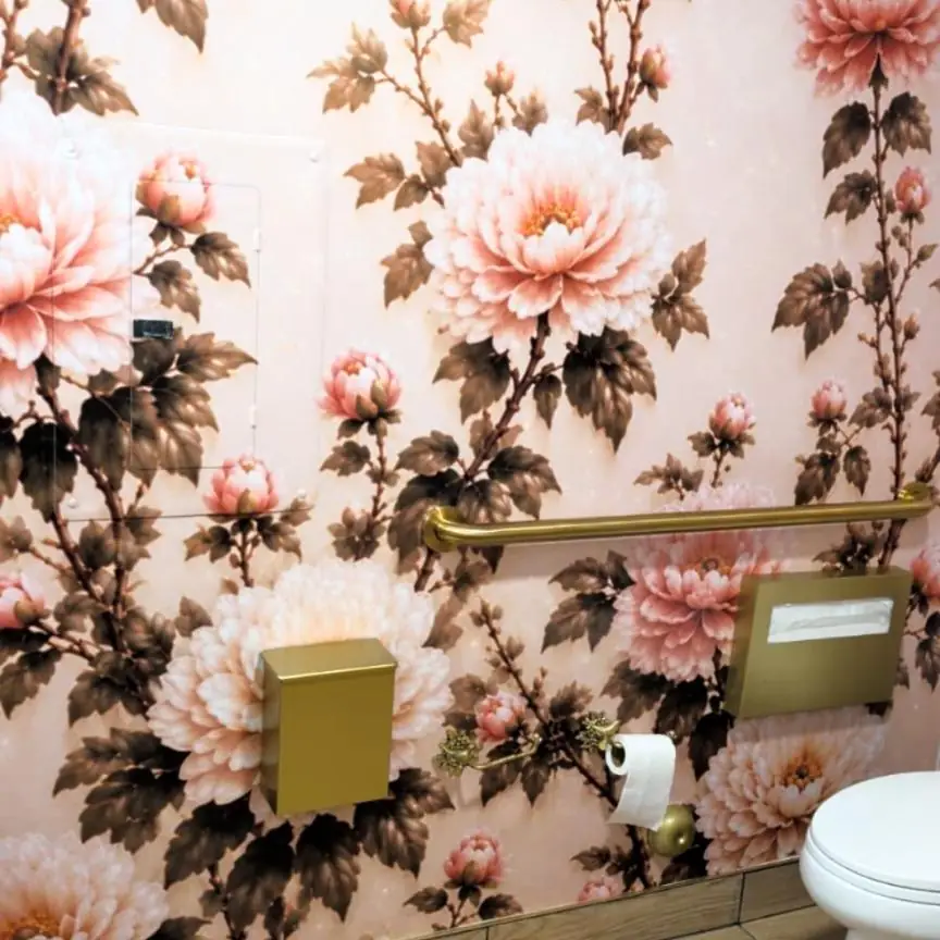 Finished floral wall covering in a restroom