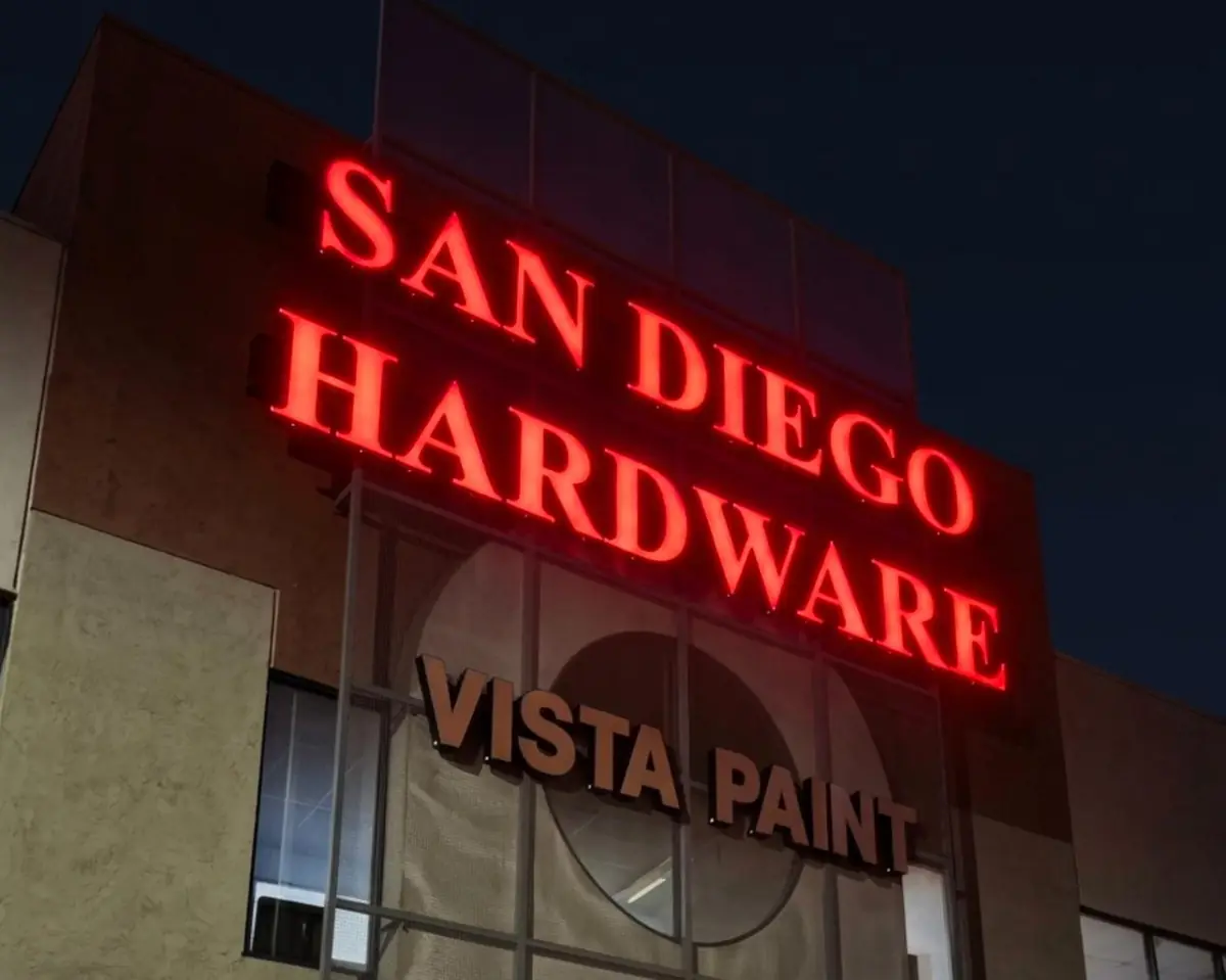 San Diego Hardware and Vista Paint channel letters lit red at night