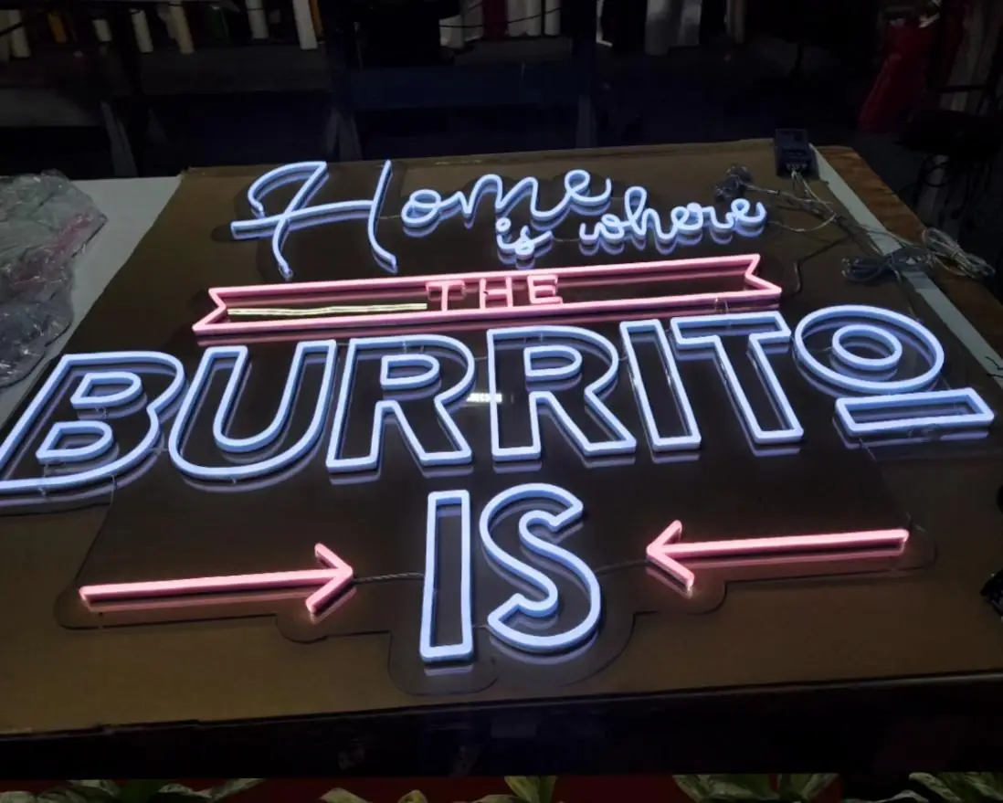 Home is Where the Burrito Is neon sign finished on the shop bench