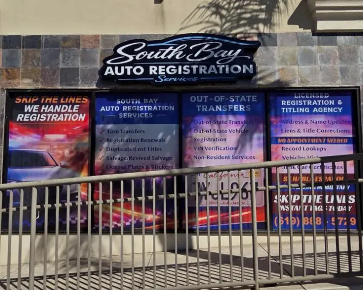 South Bay Auto Registration Services storefront covered in printed window graphics