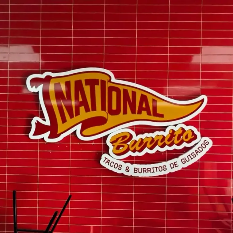 National Burrito logo sign mounted on a red tile wall