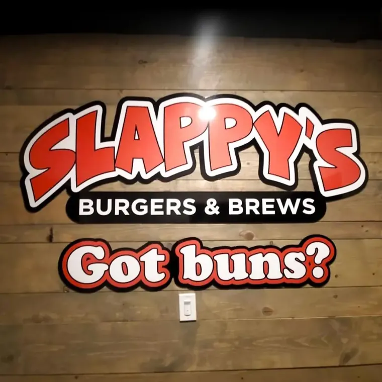 Slappy’s Burgers and Brews Got Buns dimensional sign on a wood wall
