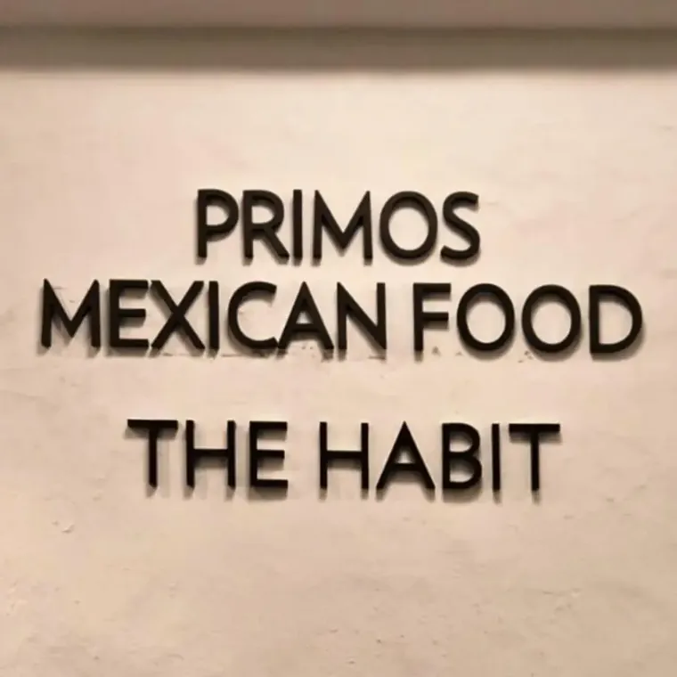Primos Mexican Food and The Habit flat cut letters on a stucco wall