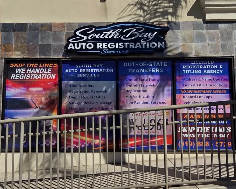 South Bay Auto Registration Services storefront covered in printed window graphics